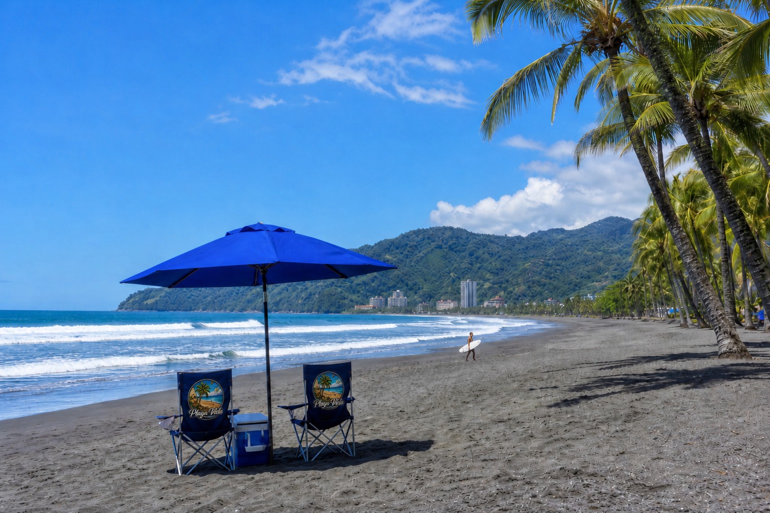 Playa Vida beach chairs and umbrella on the gray volcanic sand of Playa Jacó with palm trees and Pacific surf
